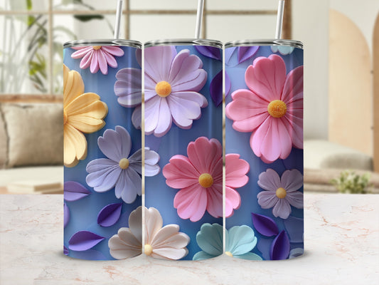 Three tumblers with pastel floral designs in blues, pinks, and yellows.