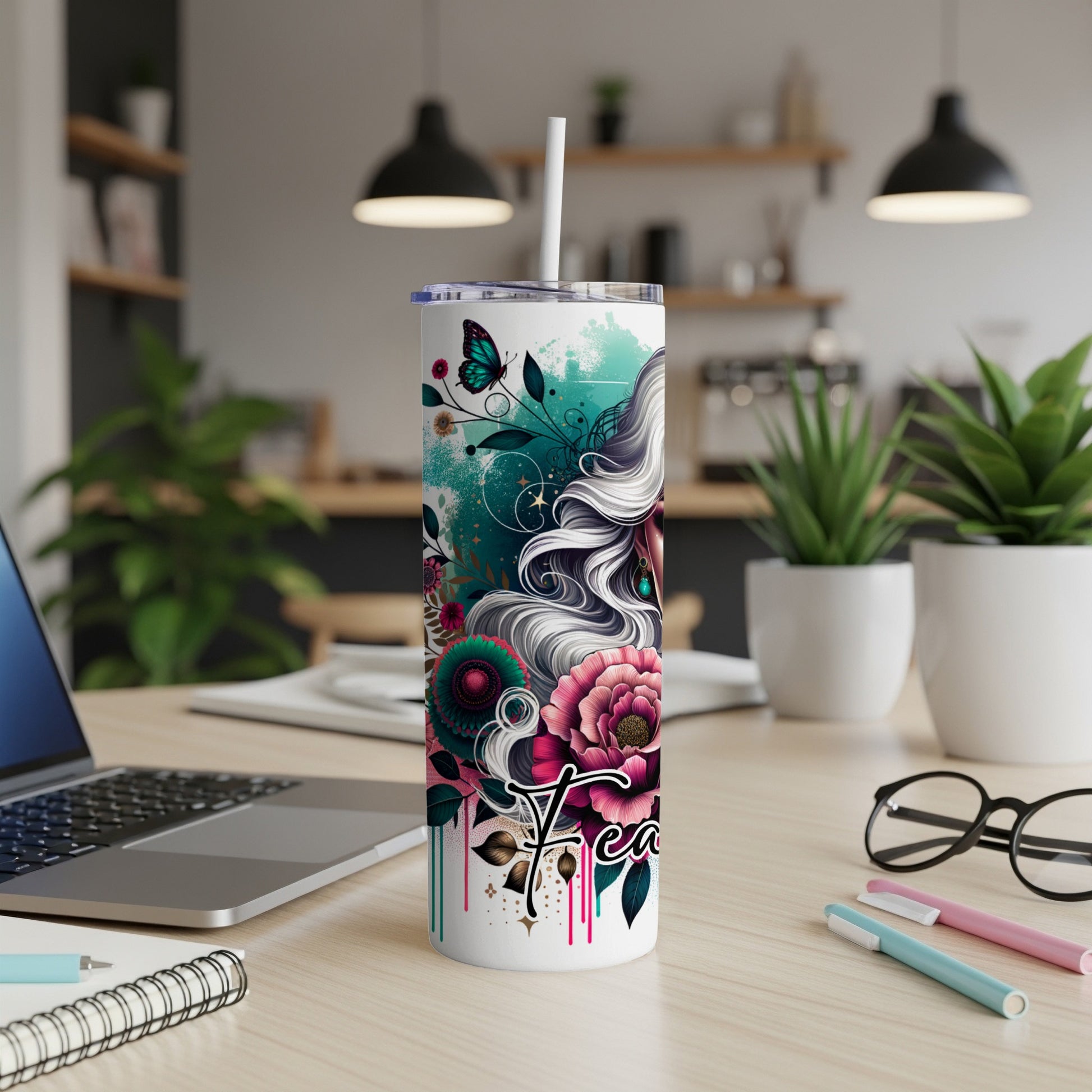 Tumbler with floral and butterfly design, featuring the word "Peace".