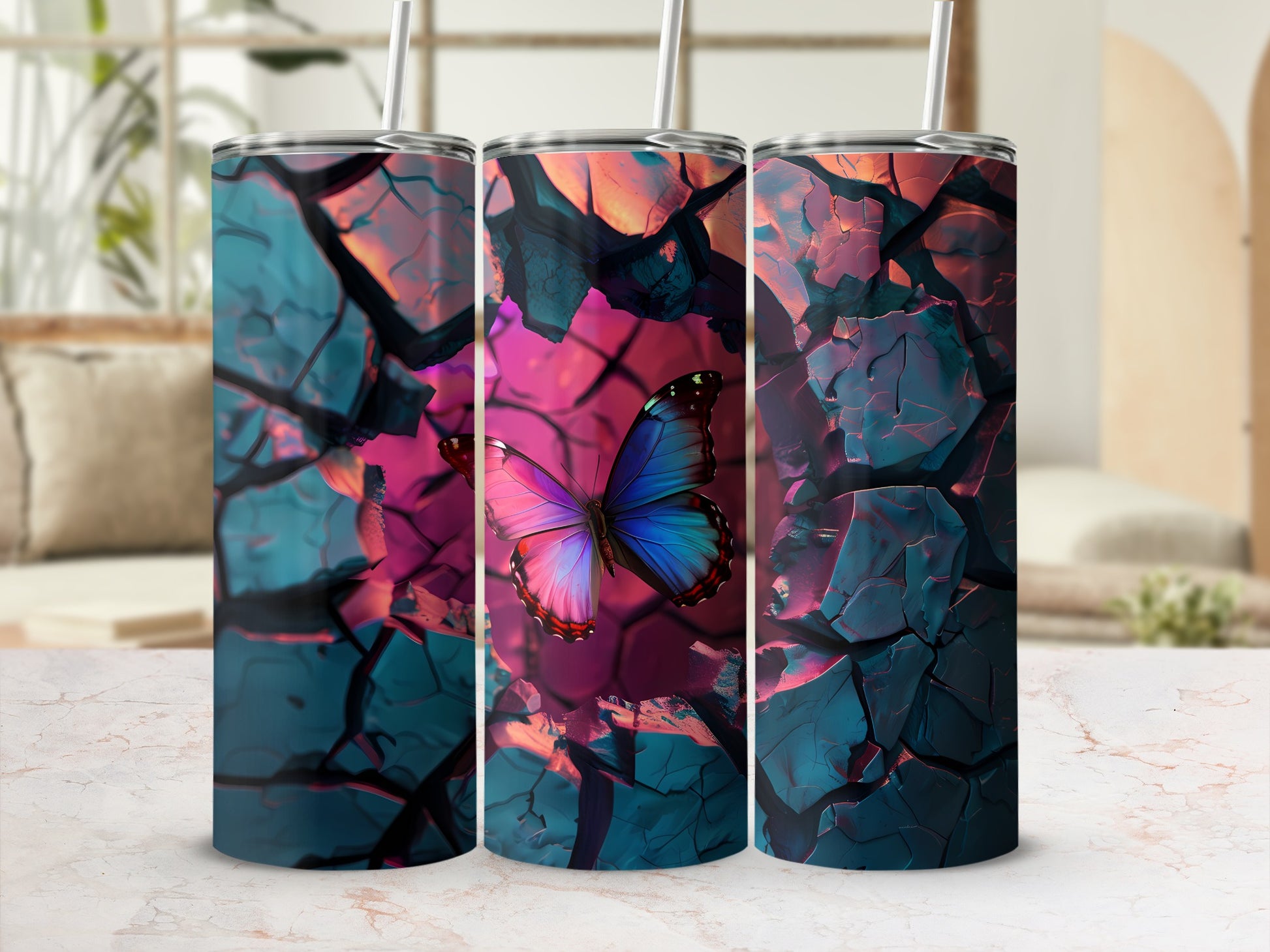 Three tumblers featuring a cracked earth design with a vibrant butterfly.