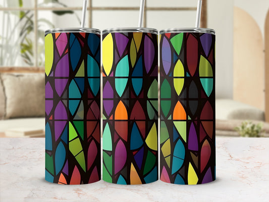 Triptych of tumblers with colorful stained-glass pattern on marble surface.