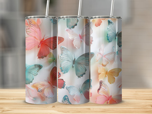 Three tumblers with iridescent butterfly patterns in various pastel colors.