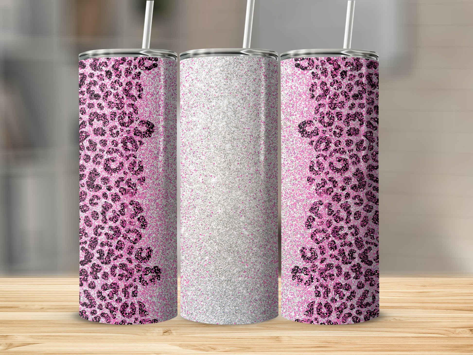 Pink leopard print and glitter design on a set of three skinny tumblers.
