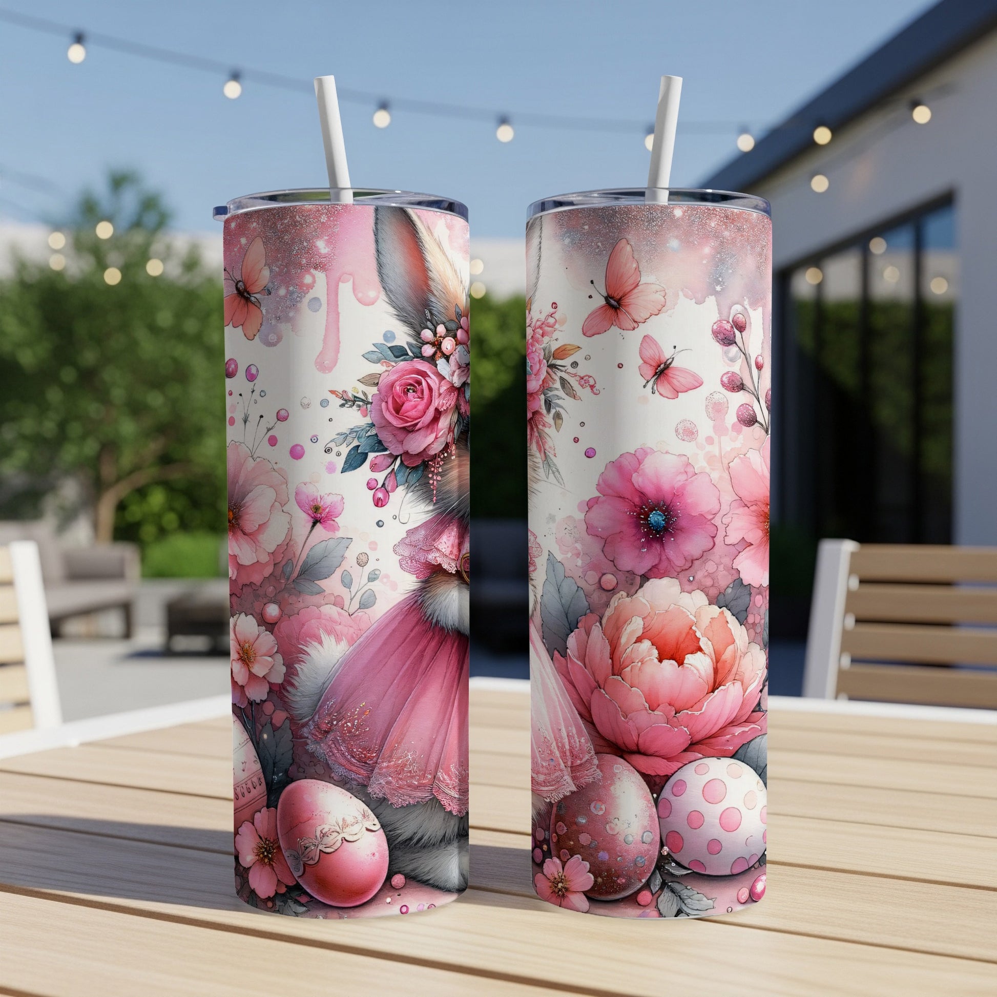 Two tall tumblers with pink Easter bunny and floral designs.