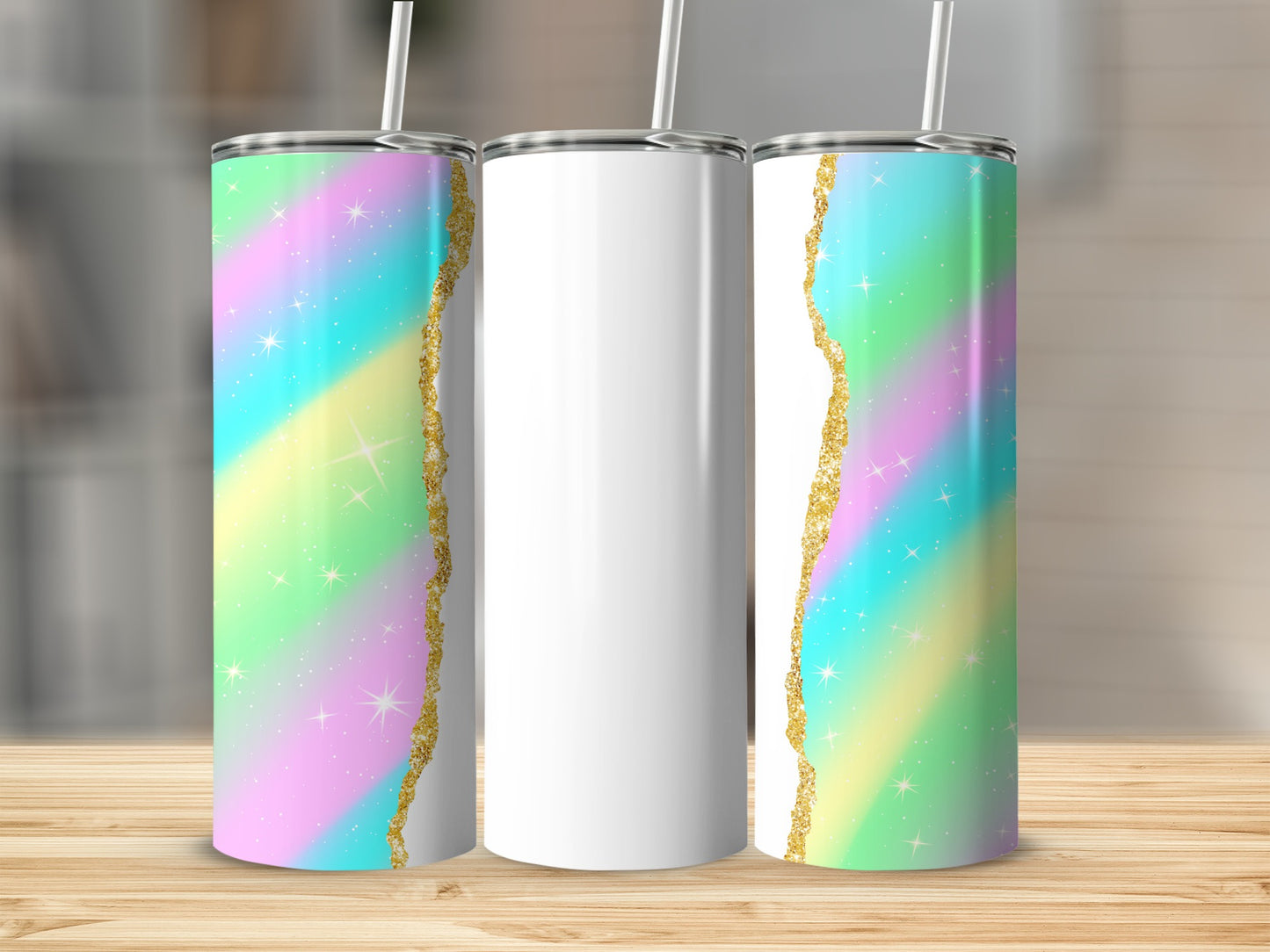 Two tumblers with pastel rainbow and gold glitter design, one white tumbler.