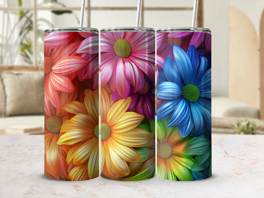Three tumblers with colorful floral designs, arranged side-by-side.