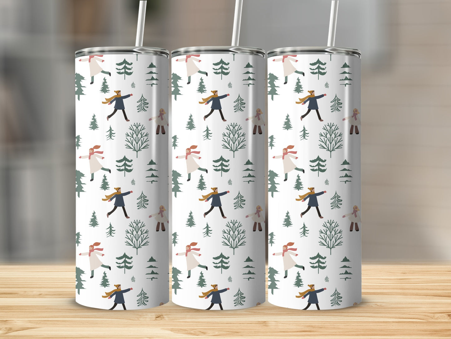 Three tumblers with a winter pattern of people and trees.