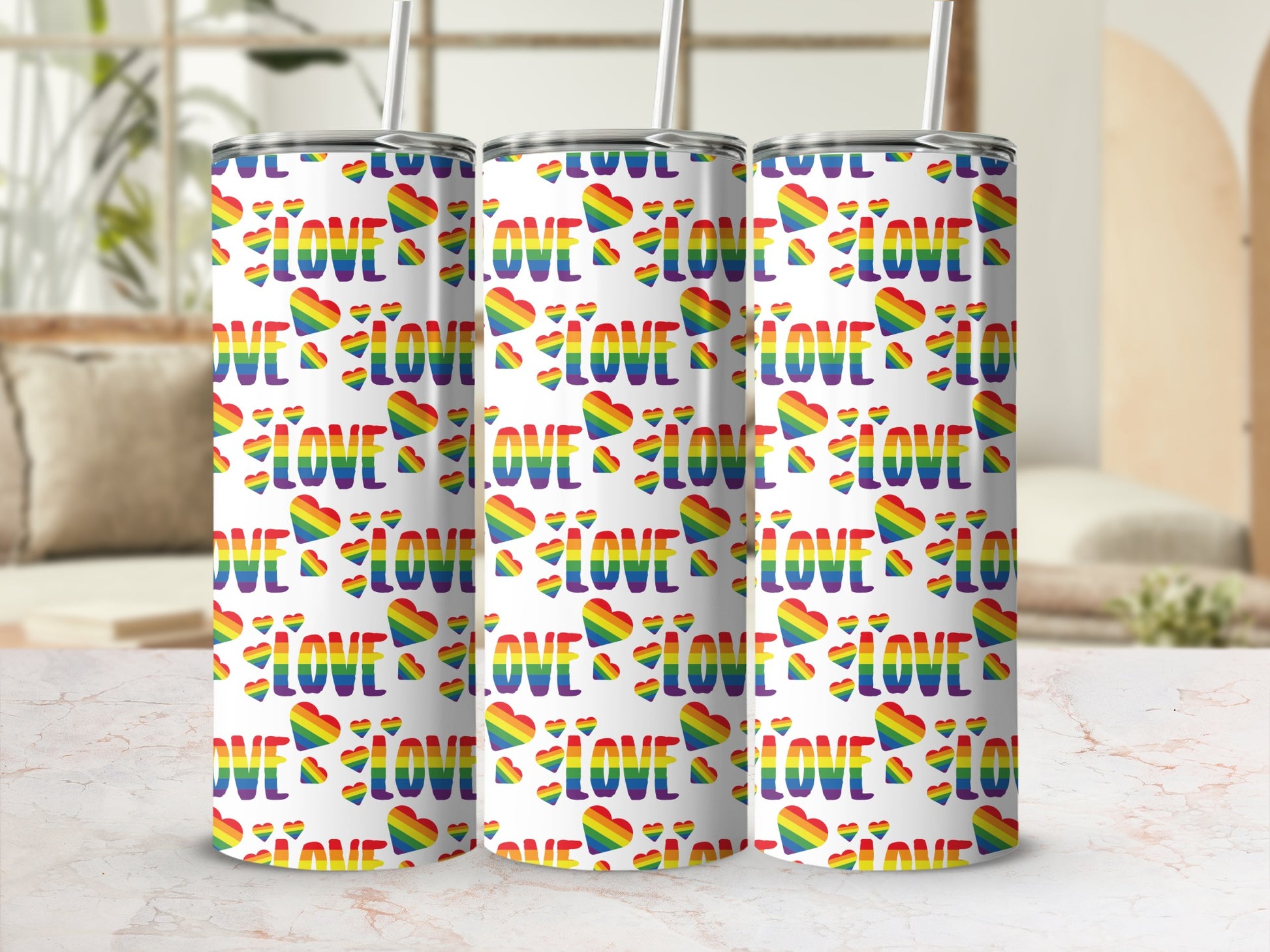 Three tumblers with a repeating rainbow heart and "LOVE" pattern.