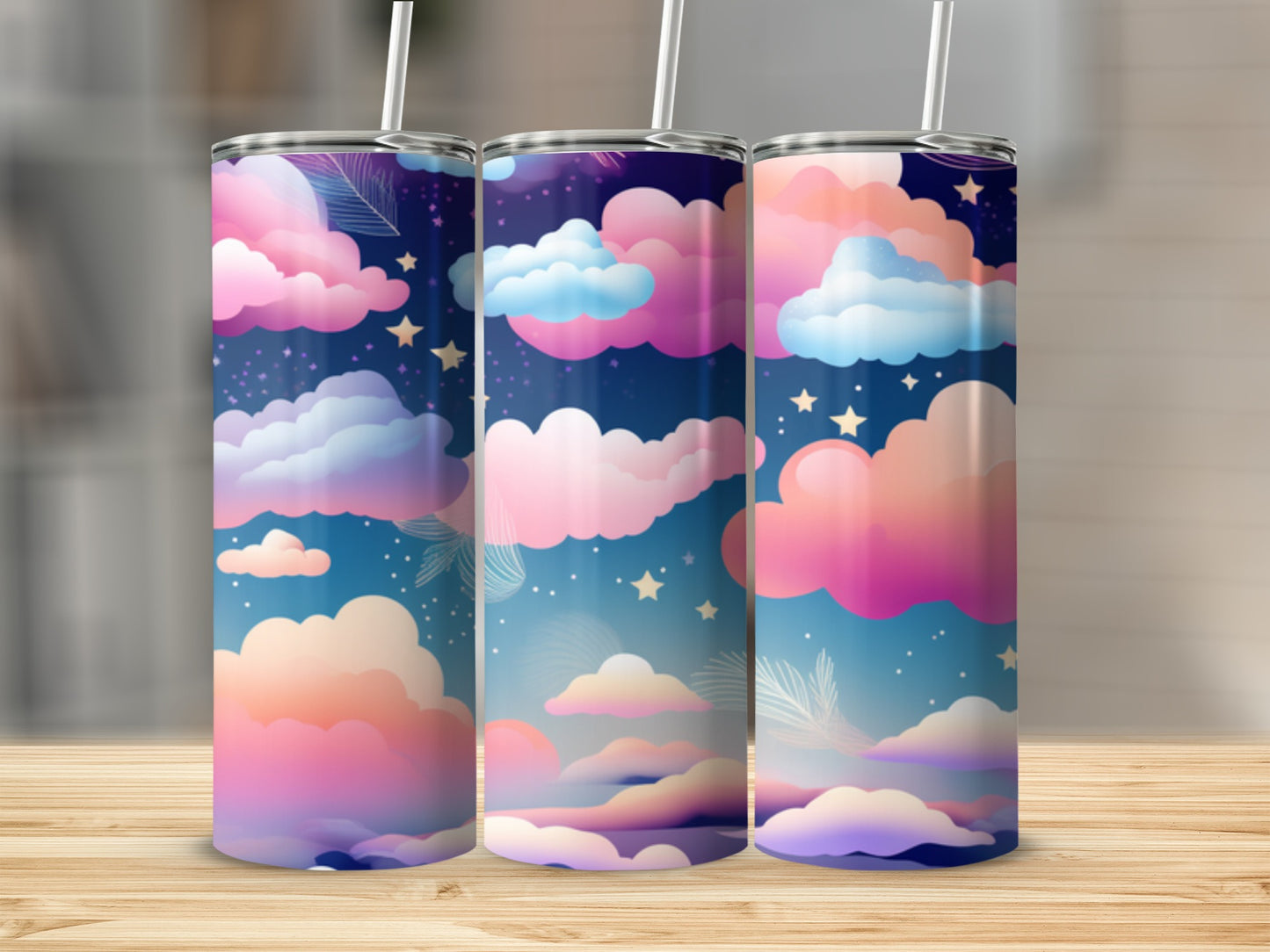 Three tumblers with a pastel cloudy night sky design.