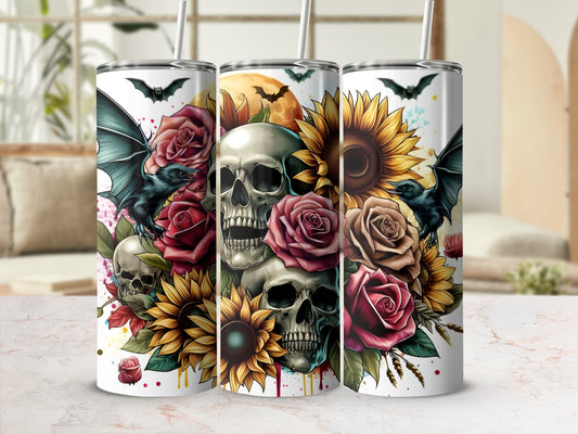 Three Halloween-themed tumblers with skulls, bats, roses, and sunflowers.