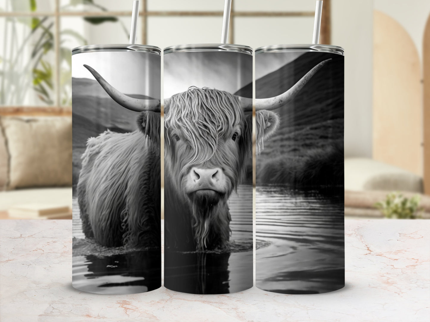 Highland cow with long horns standing in water.