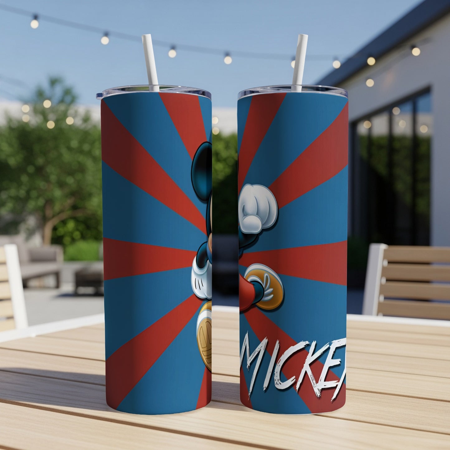 Mickey Mouse on a blue and red striped tumbler with straw.