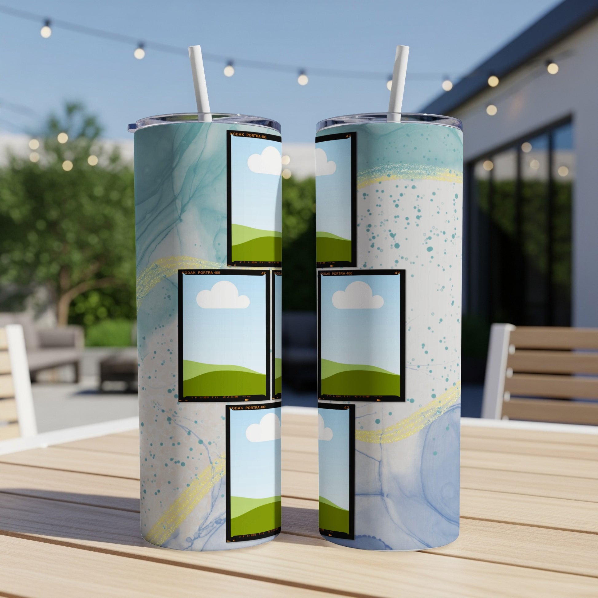 Two tumblers with abstract blue and white watercolor design and film strip photo frames.