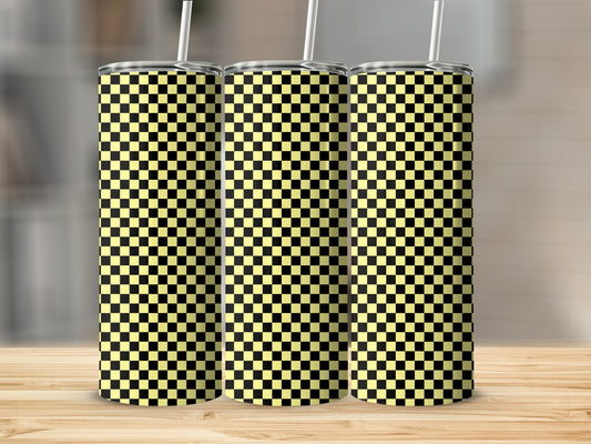 Three tumblers with black and yellow checkered pattern on a wooden surface.