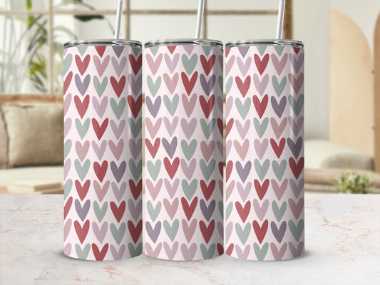 Three tall tumblers with a repeating pattern of small, muted hearts.