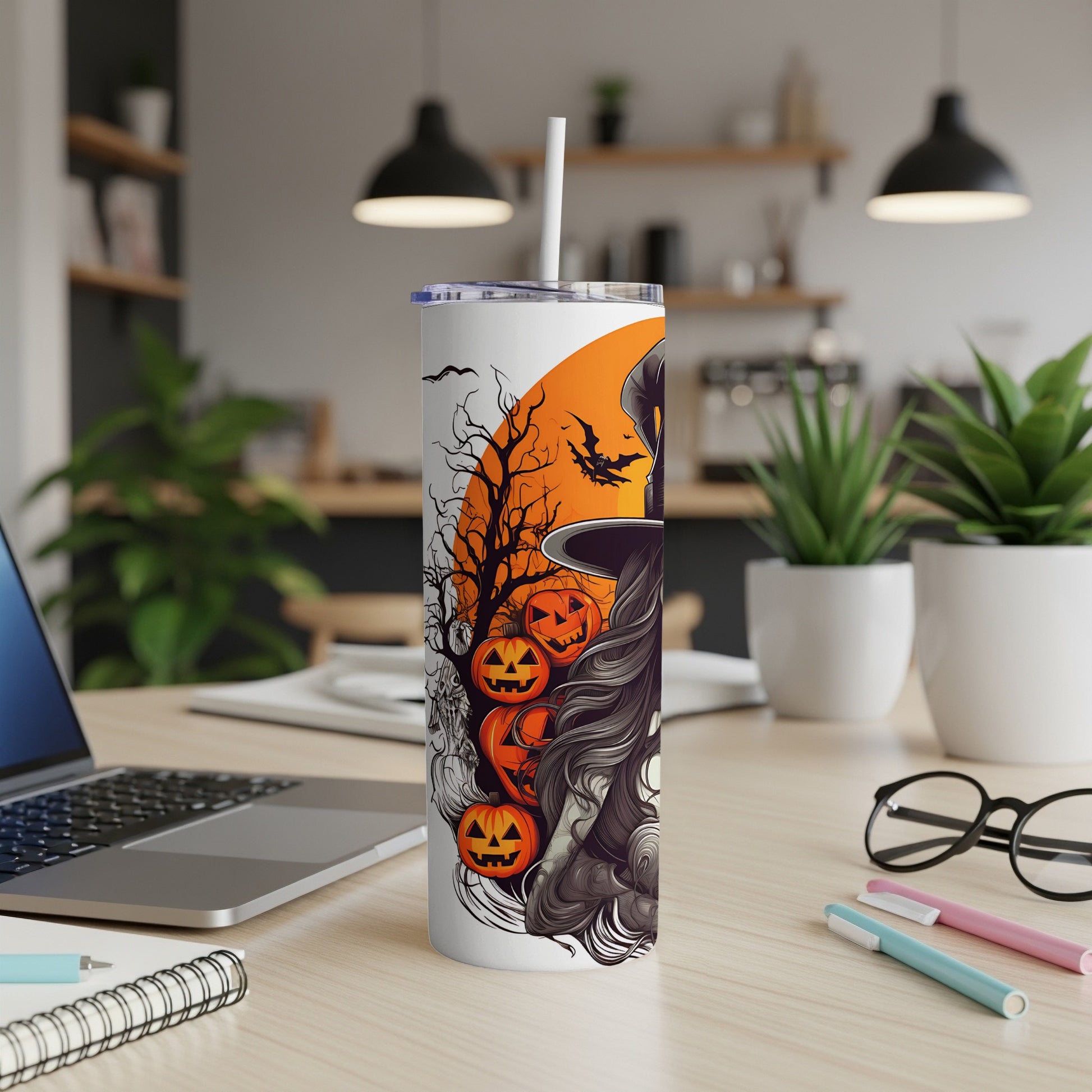 White tumbler with Halloween witch, pumpkins, bats, and spooky tree design.