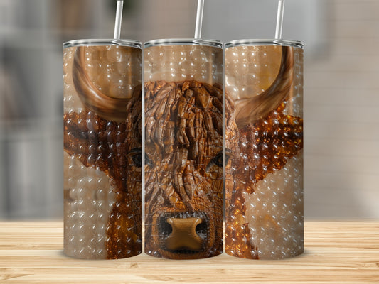 Three tumblers showing a carved Highland cow head with textured fur and horns.