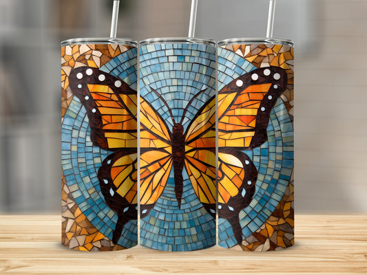 Three tumblers featuring a mosaic butterfly design on a blue background.