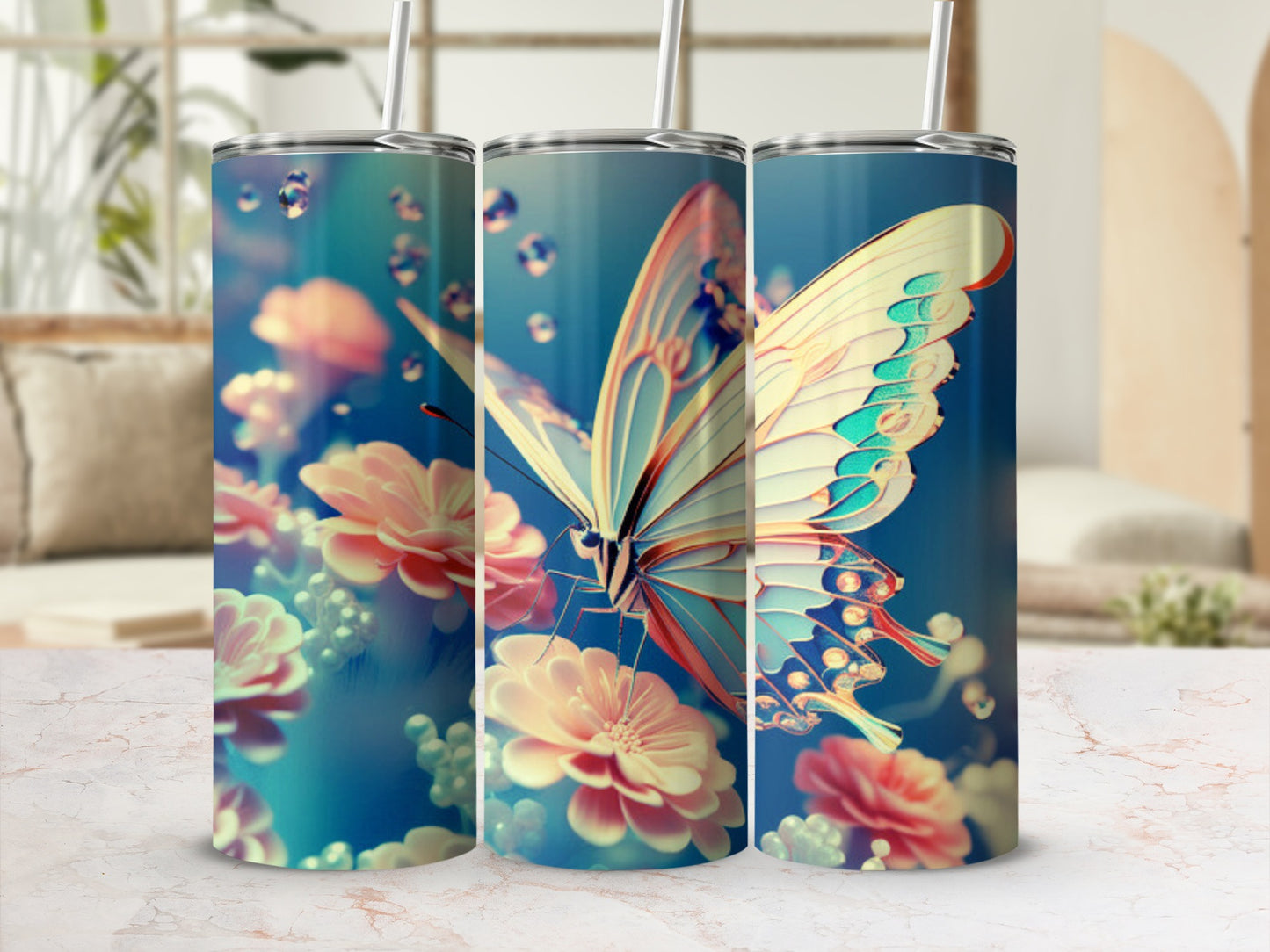 Three tumblers with a butterfly and floral design on a marble countertop.