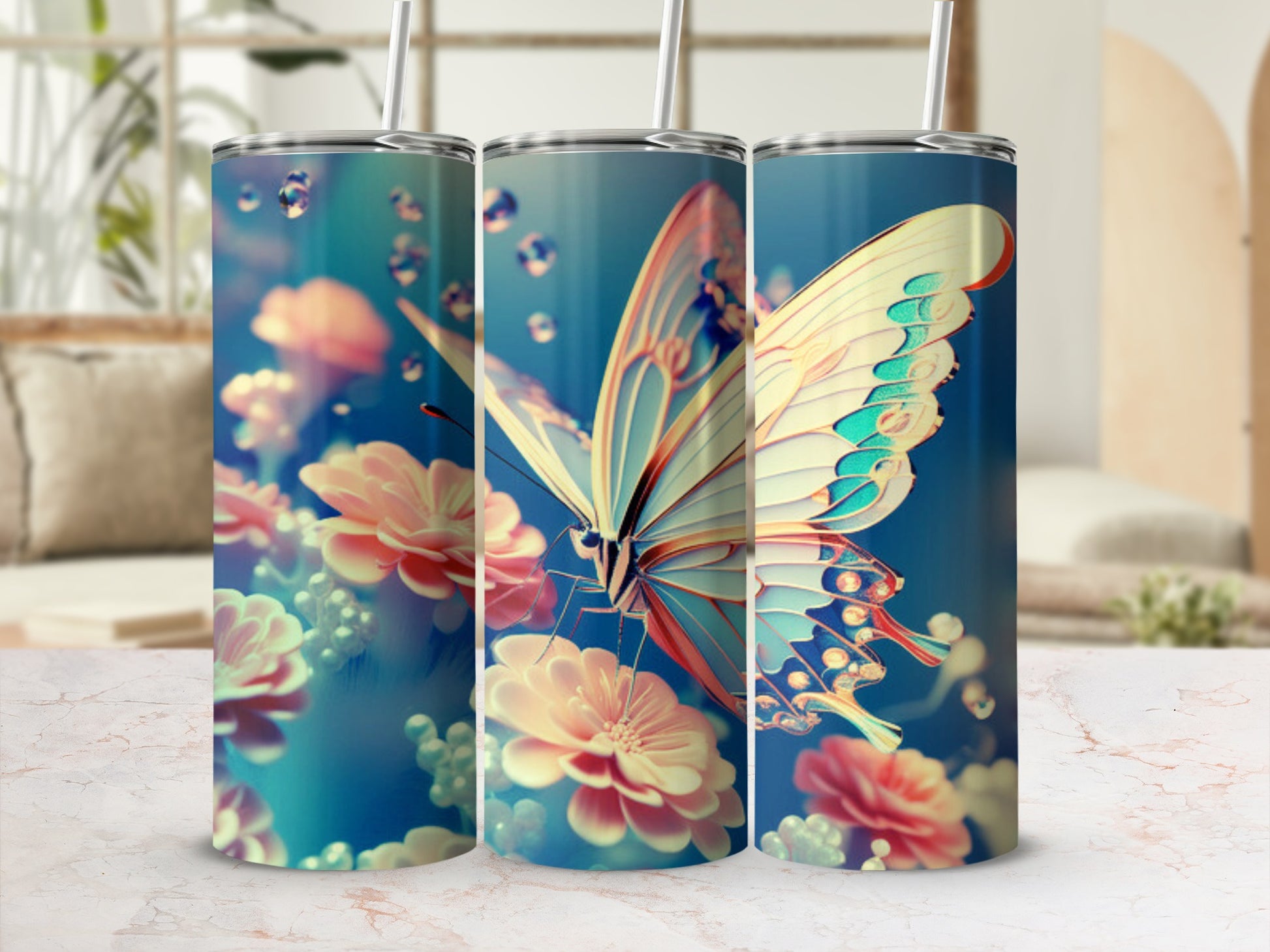Three tumblers with a butterfly and floral design on a marble countertop.