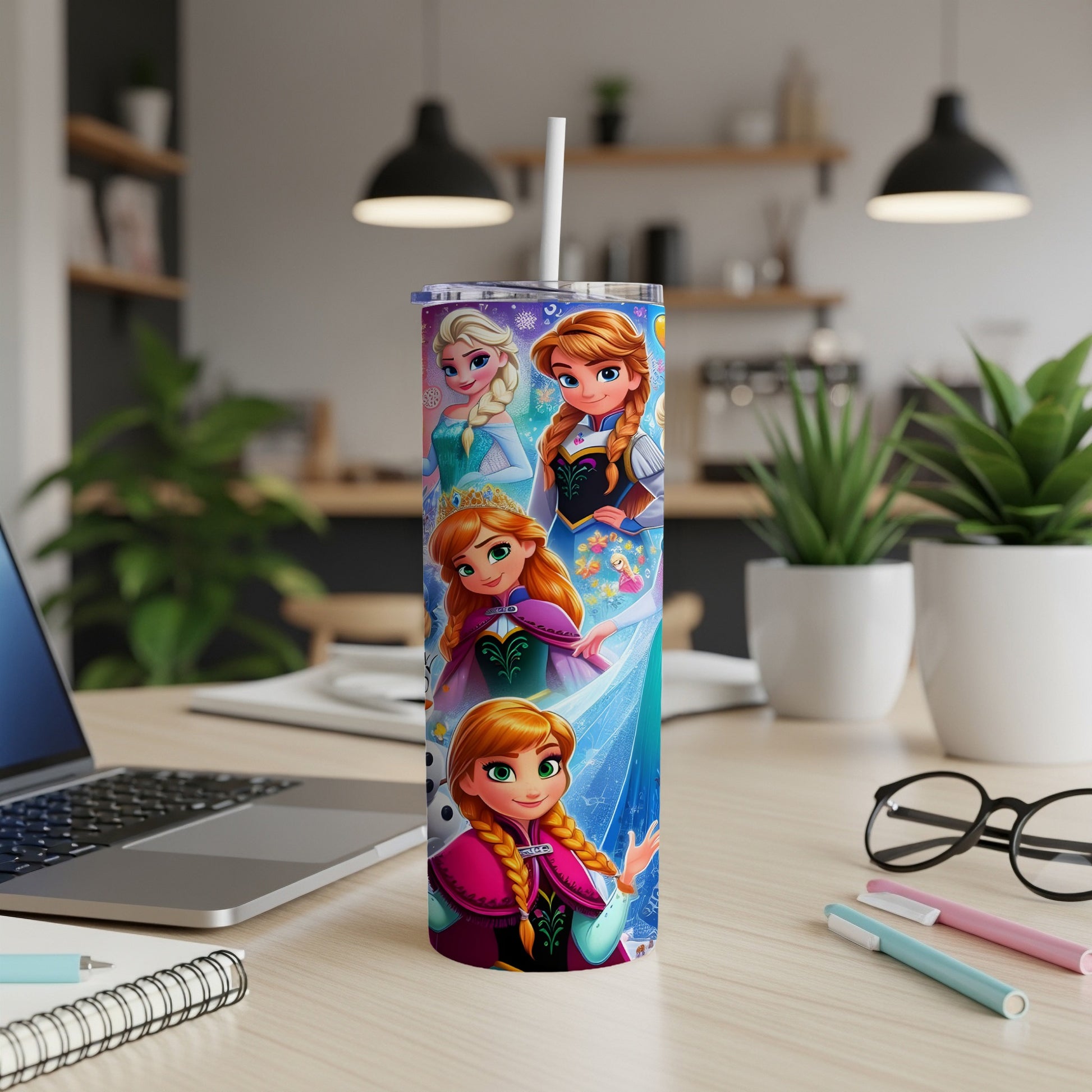 Elsa and Anna from Frozen on a blue speckled tumbler with a straw.