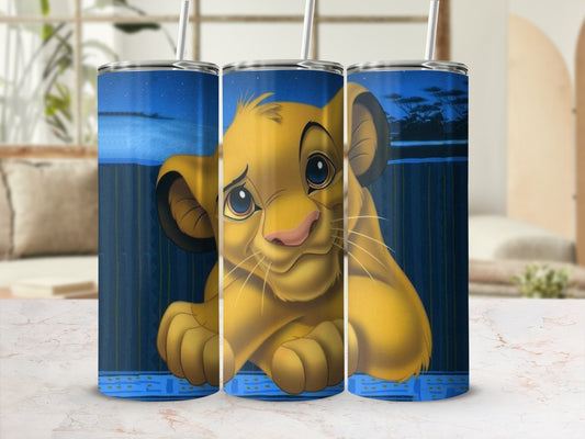 Simba the Lion King character on a blue tumbler with a straw.