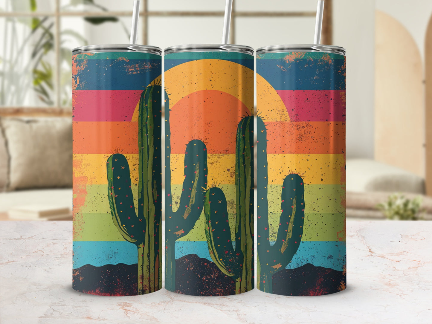 Three skinny tumblers with a vintage desert sunset and cactus design.