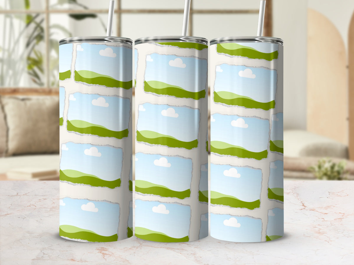 Three tumblers with a torn paper collage of rolling green hills and blue sky.