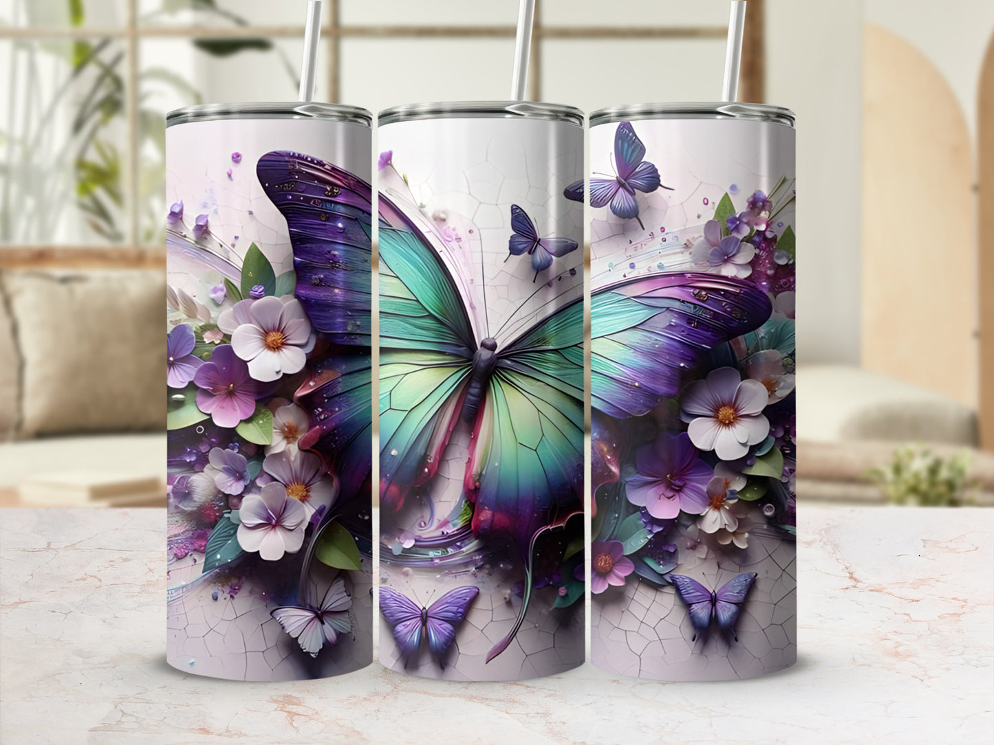 Three tumblers featuring iridescent butterflies and floral designs.