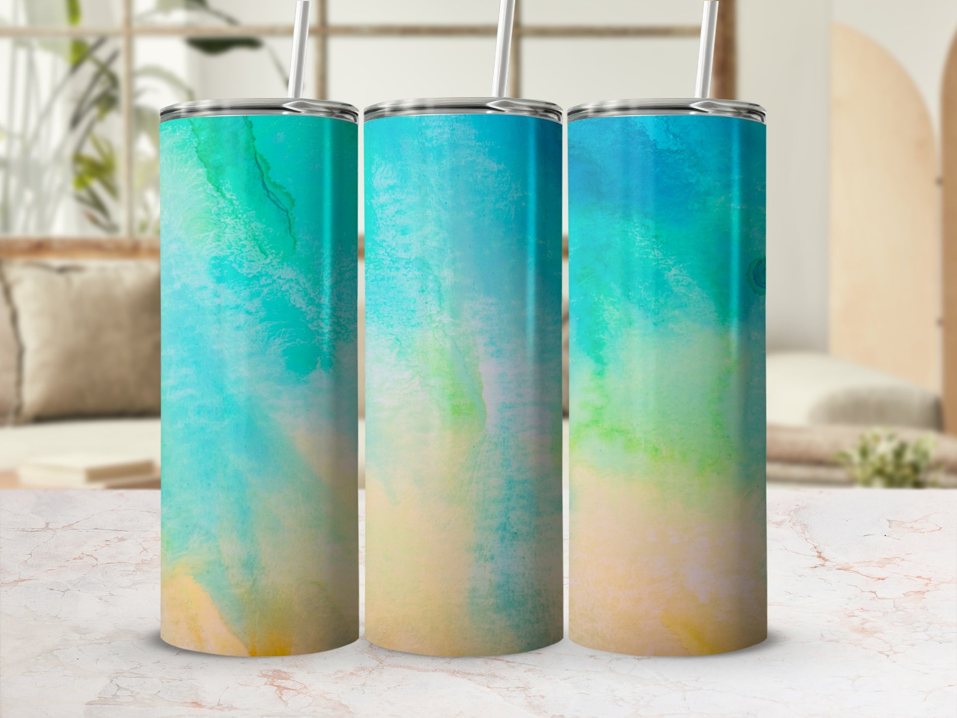 Three tumblers with a watercolor abstract pattern of blue, green, and yellow.
