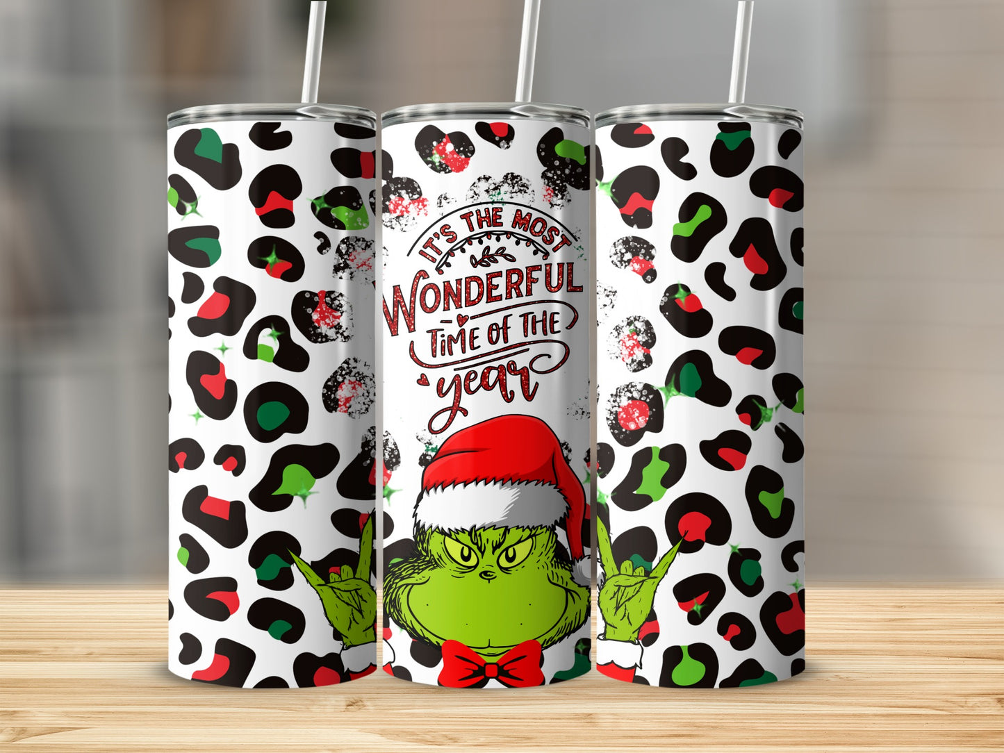 Grinch tumbler with "It's the most wonderful time of the year" text.