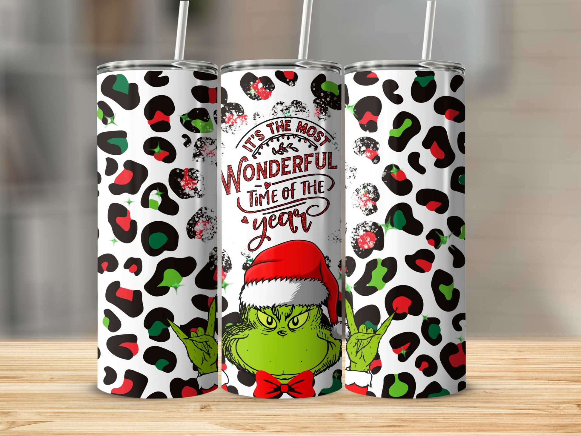 Grinch tumbler with "It's the most wonderful time of the year" text.