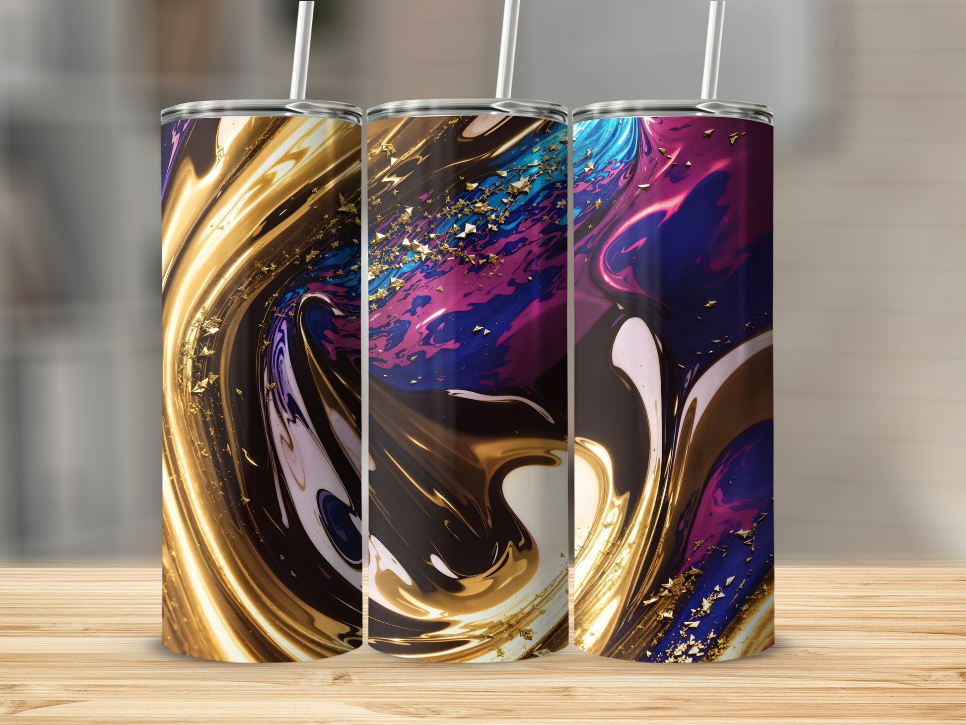 Three abstract art tumblers with gold glitter and swirling colors.