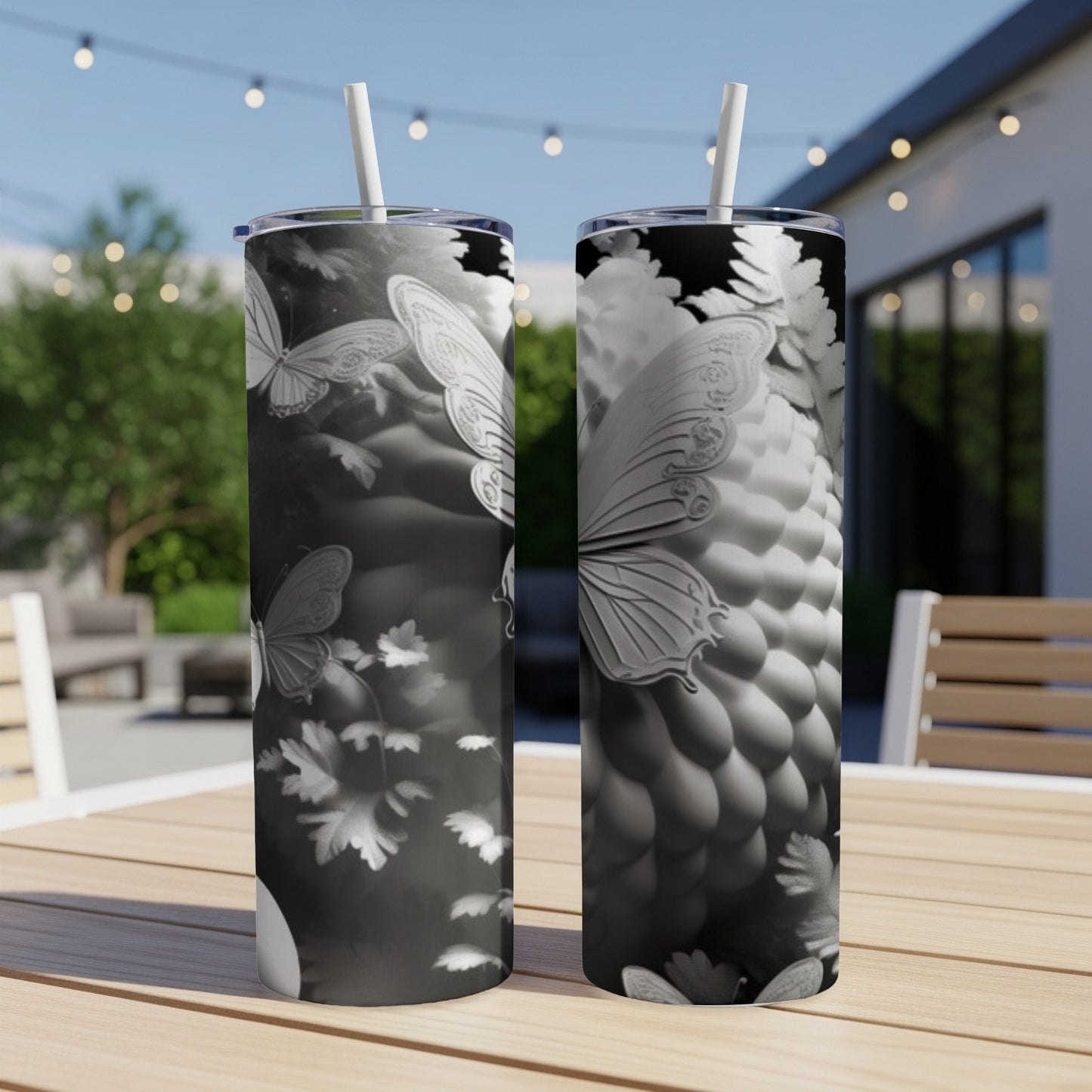 Two tumblers with white butterflies and floral motifs.