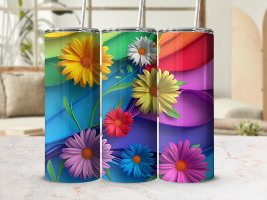 Three colorful tumblers with rainbow waves and flower designs.