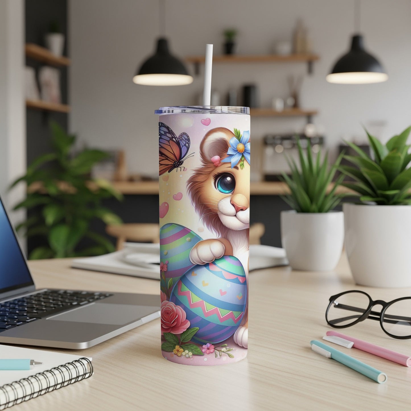 Lion cub with Easter eggs and butterfly on a pastel pink tumbler.