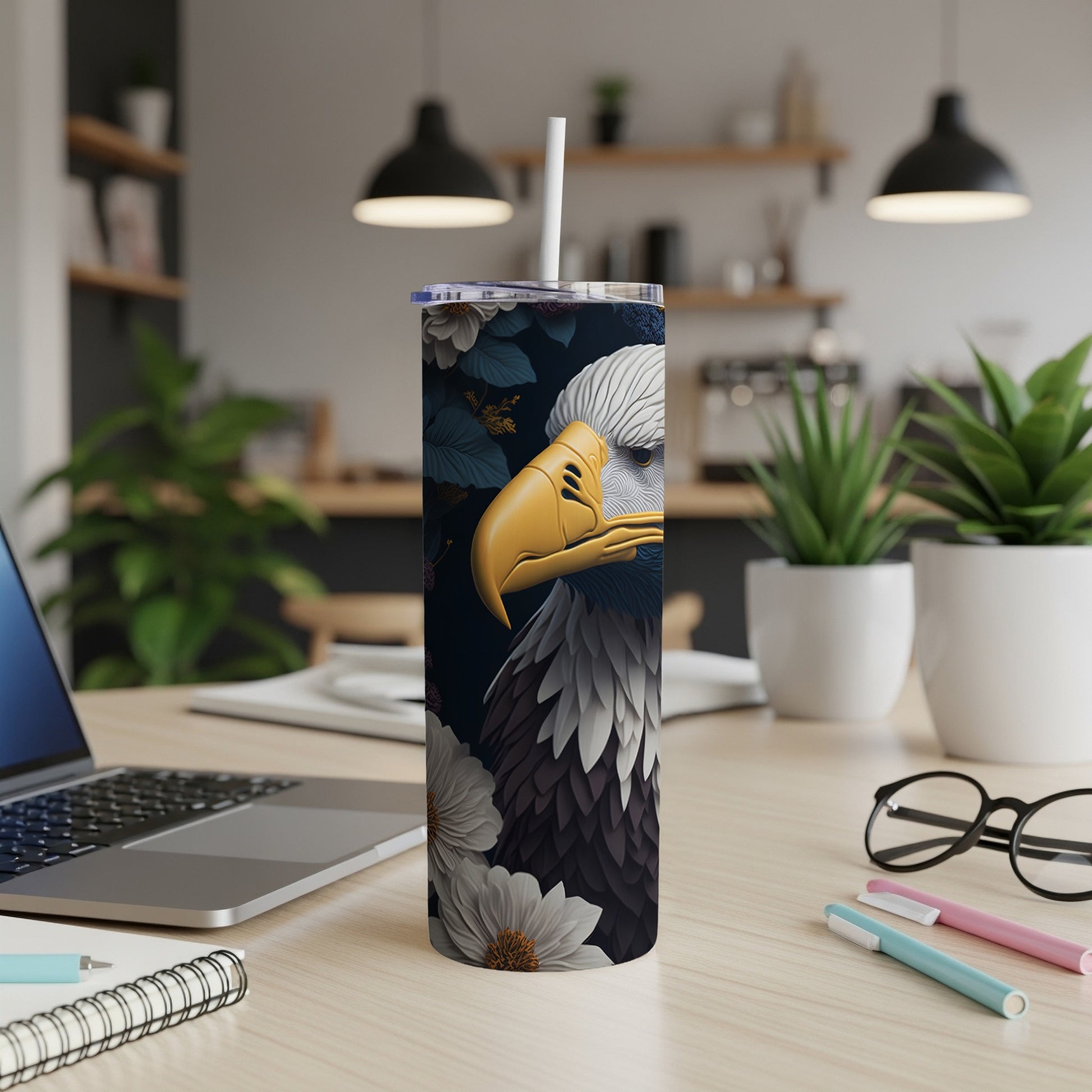 Tumbler with eagle design, white flowers, and dark floral accents.