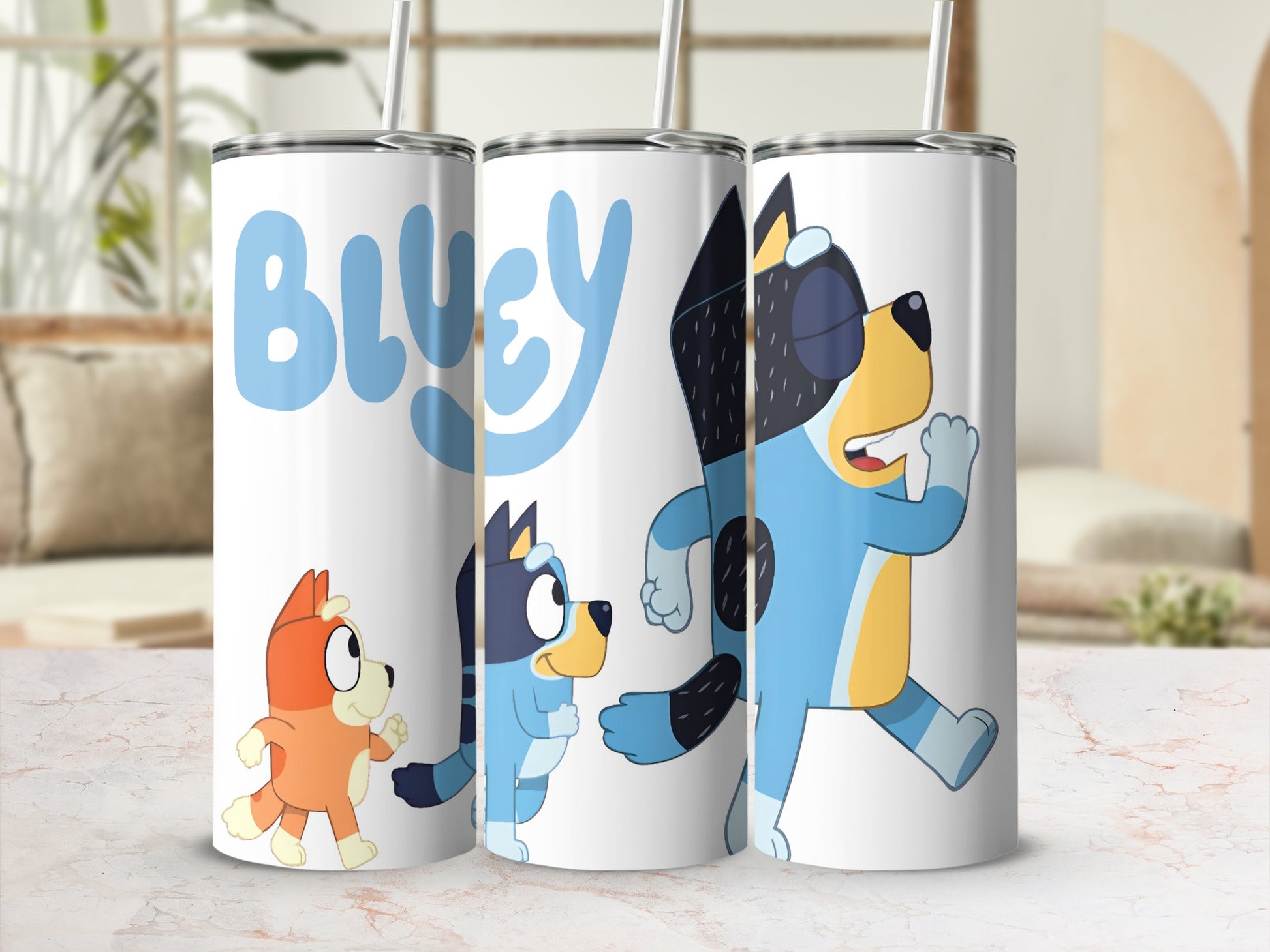 Bluey and Bingo characters on a white tumbler with straw.