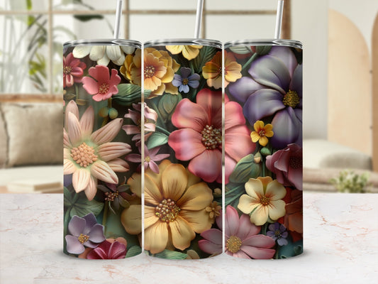 Three tumblers with a raised floral pattern in shades of pink, yellow, and purple.