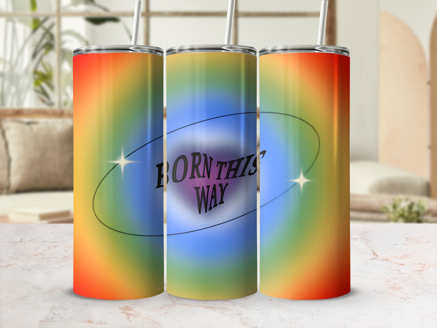 Rainbow gradient tumbler with "Born This Way" text and star accents.