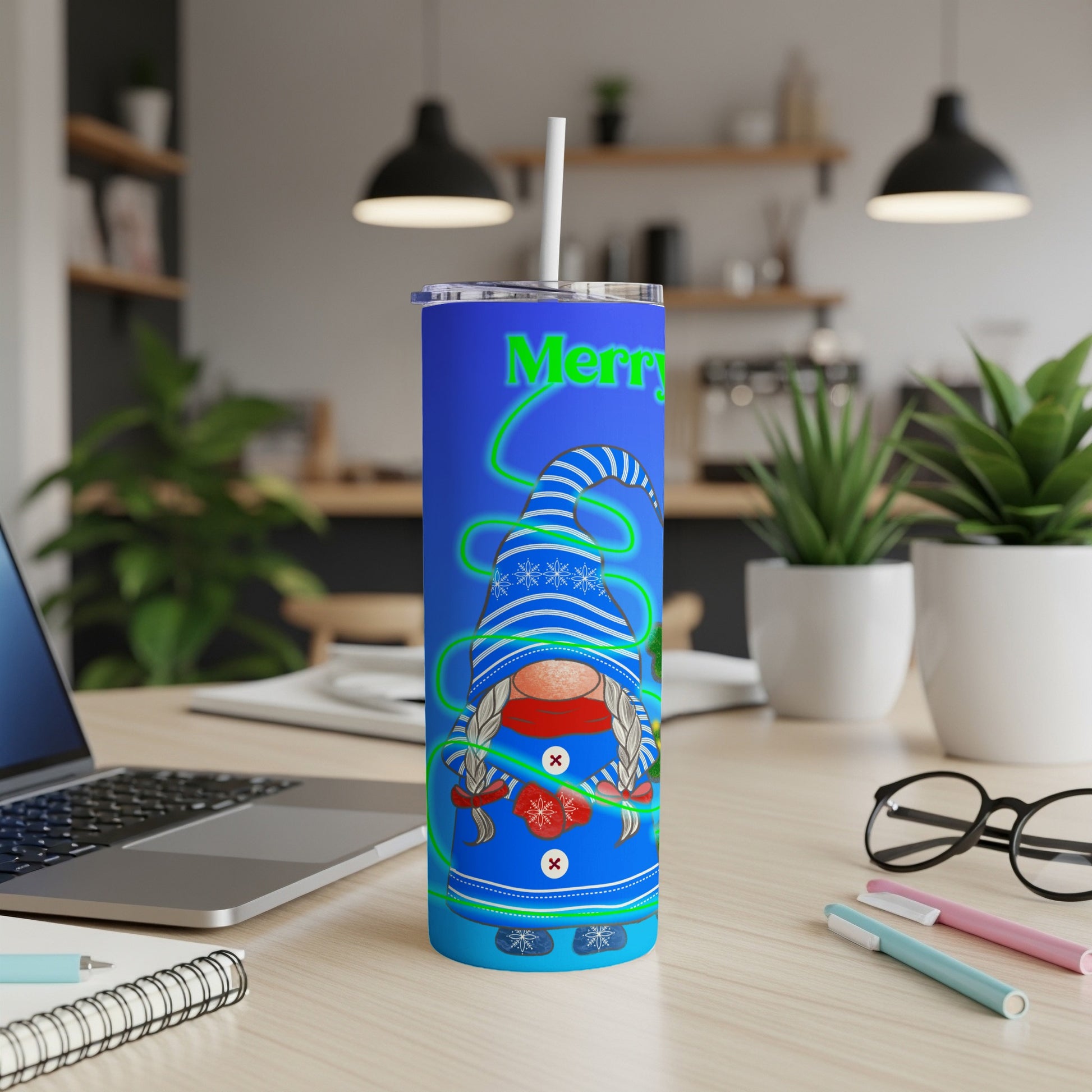 Blue tumbler with Merry text and gnome illustration.
