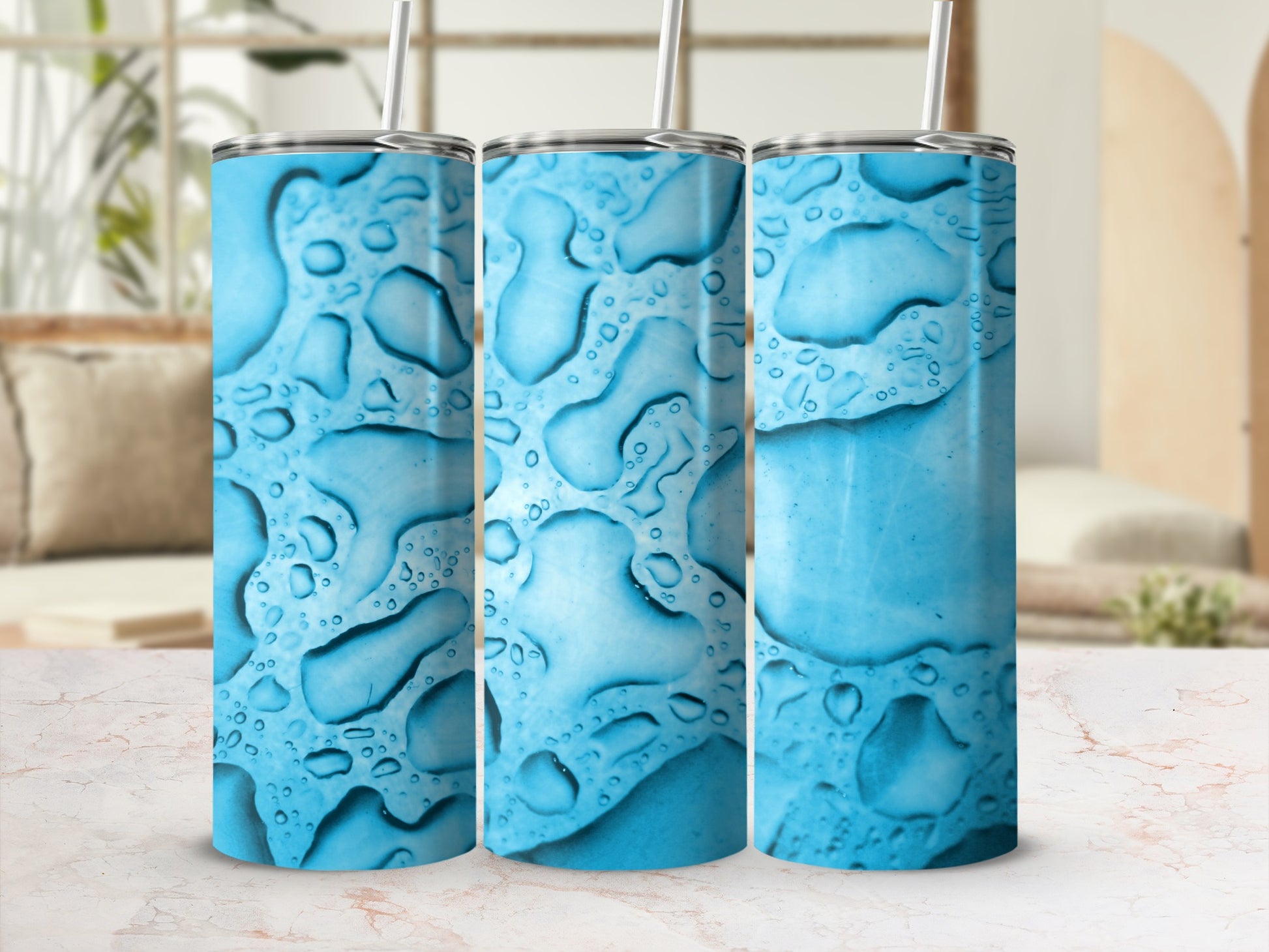 Three blue tumblers with a water droplet pattern.