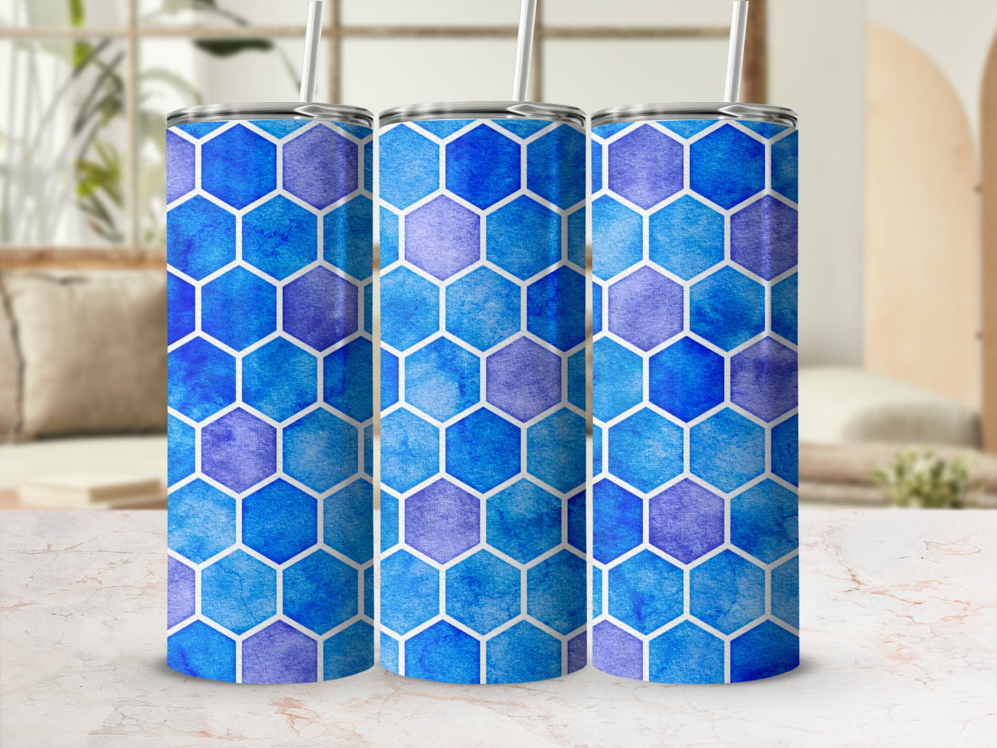 Three tumblers with a blue and purple watercolor hexagon pattern.