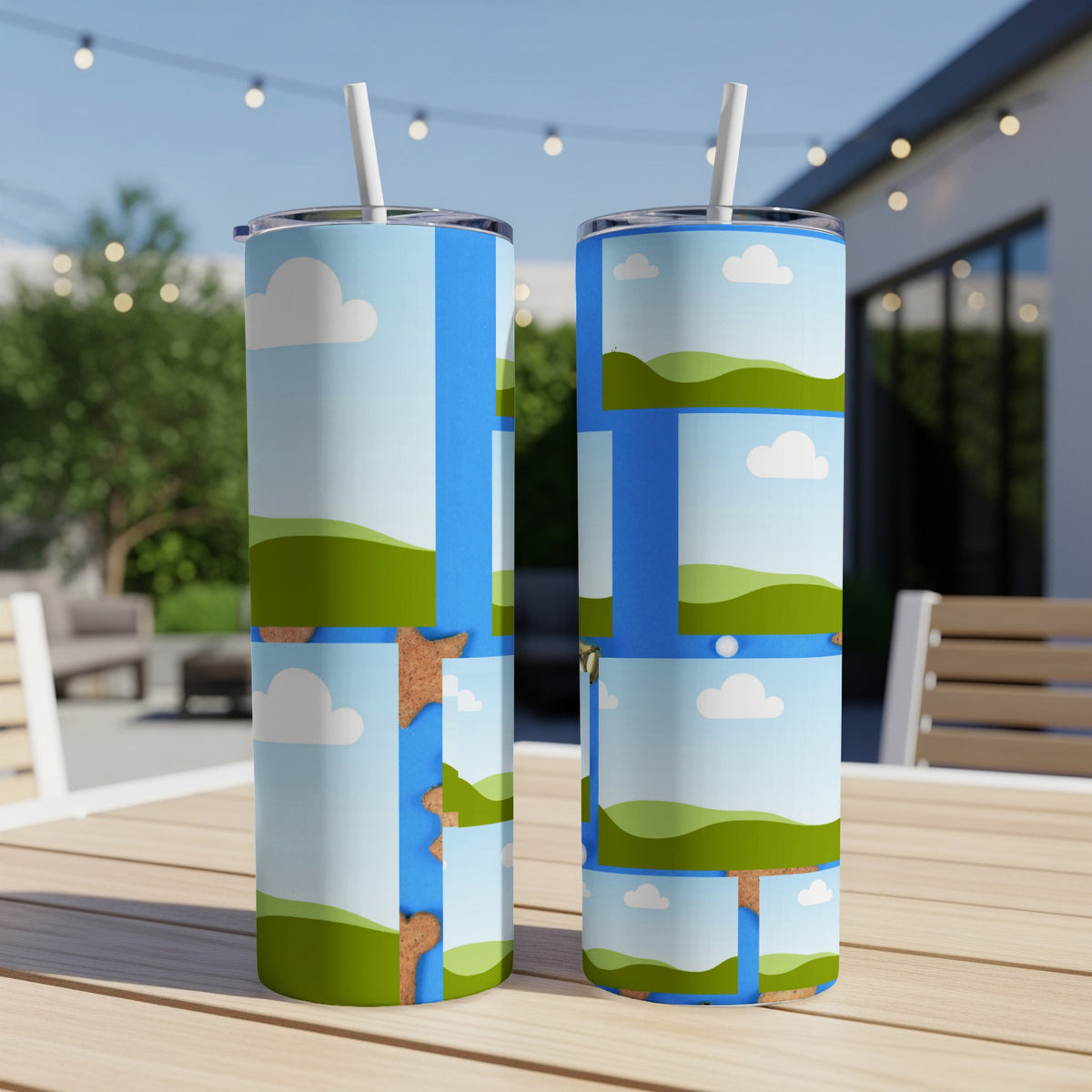 Two tumblers with a blue sky, green hills, and cloud pattern.