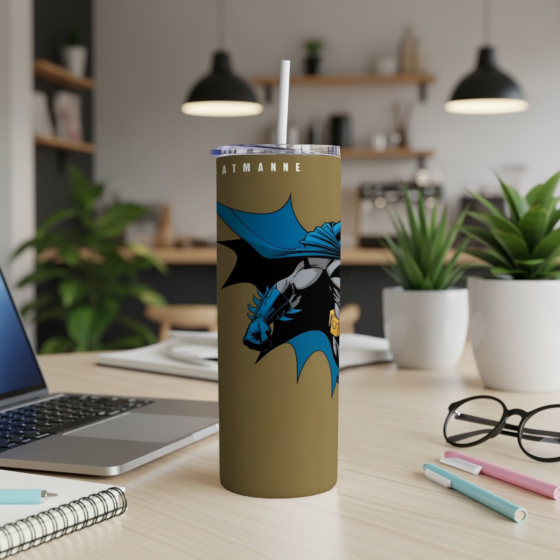Gold tumbler with Batman graphic and "BATMAN" text.