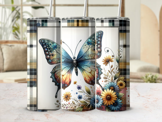 Butterfly and floral design on three insulated tumblers with plaid borders.
