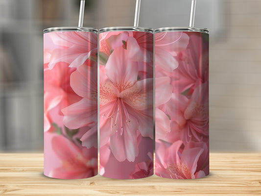 Pink floral pattern on three tumblers with straws.