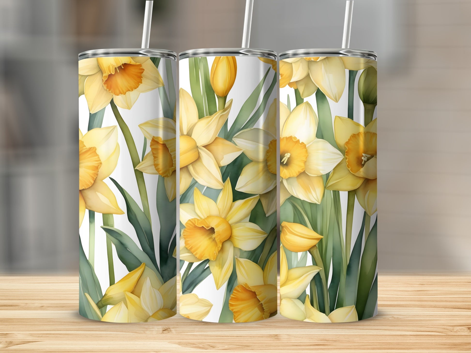 Three tumblers with yellow daffodils and green leaves pattern.