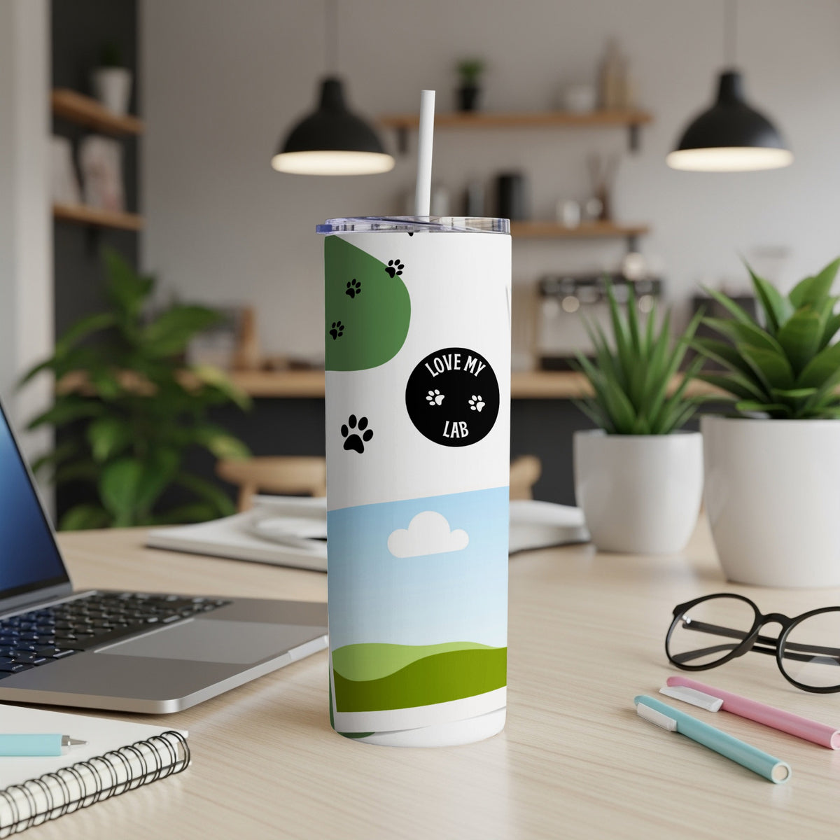 White tumbler with "Love My Lab" and paw prints on a desk.