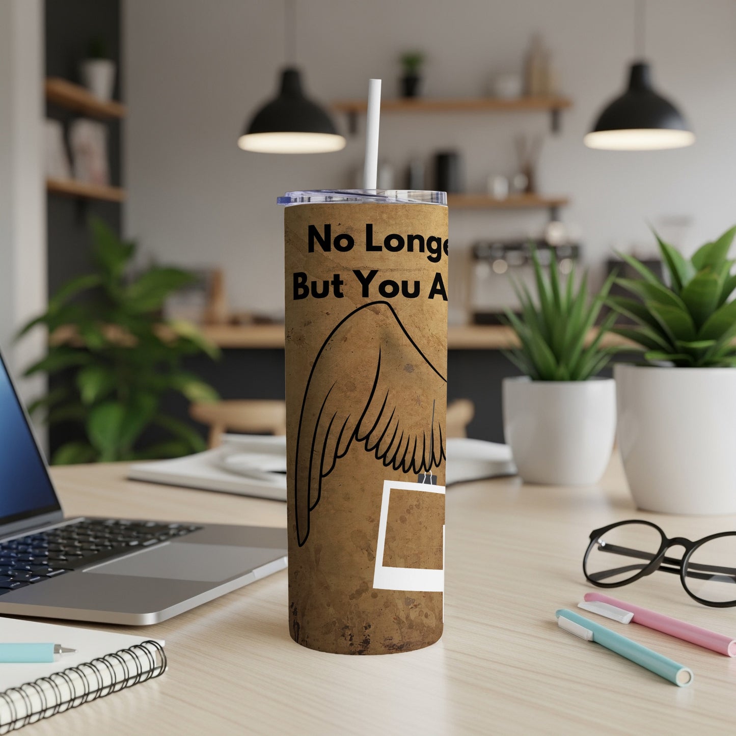 Tumbler with "No Longer But You Are" text and angel wings design.