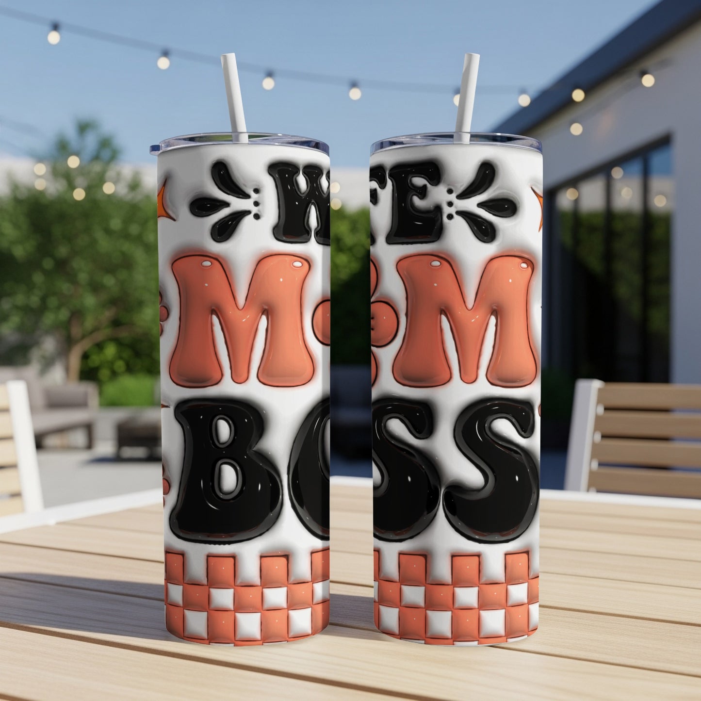 Two tall tumblers with "MOM BOSS" in bold, colorful letters on a checkered background.